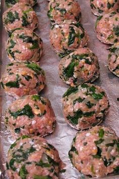 some food is laying out on a baking sheet and ready to be cooked in the oven