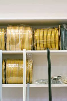 the shelves are filled with many different types of wires and wire wrapped in plastic bags