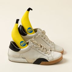 If your efforts to combat footwear funk have so far been fruitless, try going a little bananas. This pair of playful deodorizers efficiently eliminates unpleasant odors and adds sunny yellow cheer to your shoe-care routine. Plus, the banana design makes them the ideal shape to slide into all kinds of footwear, from flats to boots and everything in between.   Contains a blend of odor-neutralizing salts, minerals, and botanicals with a fresh fragrance of lavender, lemon, patchouli, and tea tree.  Designed to remove and prevent extreme and ingrained odors in sports shoes and boots. (Only intended for removing sweat and smells, not for drying drenched footwear.)  Can also be used to freshen gloves, sports gear, and any enclosed space. Just like real bananas, these will eventually “ripen” and t Natural Shoe Deodorizer, Banana Design, Deodorize Shoes, Custom Flask, Cleaning Gift, Entertaining Gifts, Uncommon Goods, Lavender Lemon, Ideal Shape