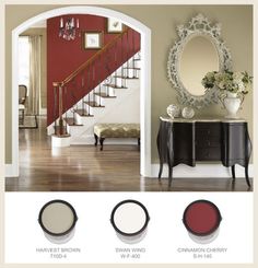 the interior paint colors are red, brown, and white in this room with stairs