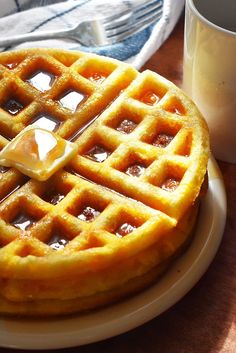 a waffle on a plate with syrup