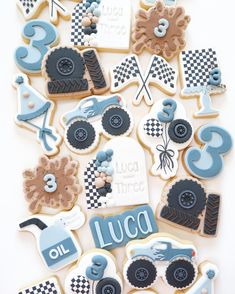 decorated cookies are arranged in the shape of race cars