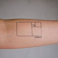 a person's arm with a small square tattoo on the left side of his arm