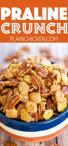 a blue bowl filled with pecans on top of a wooden table