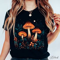 Three Mystic Mushrooms Unisex Tee Shirt | Goblincore Mushroom Shirt | Botanical Tee | Nature Lover Tee ✔️ Soft, light and comfortable unisex short sleeve tee ✔️ 100% Airlume combed and ringspun cotton (fiber content may vary for different colours*) ✔️ Light fabric (4.2 oz/yd² (142 g/m ✔️ Retail fit 📏 Runs true to size ✔️ Dual side seams for structural support of the garment help hold its shape longer ✔️ Ribbed knit elastic collars to bolster shaping, twill taped shoulders to prevent stretching Mushroom Tshirt, Mushroom T Shirt, Cottagecore Clothes, Dark Cottagecore, Stretchy Tops, Limassol, Plus Size T Shirts, Top Casual, Print T Shirts