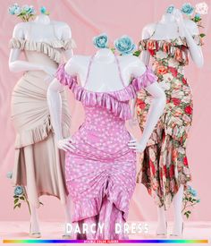 three mannequins dressed in dresses with flowers on them, one wearing a pink dress