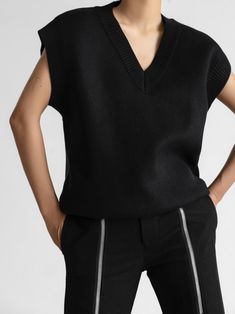 Oversized V-neck vest with wide shoulders. Style up or down, wear on its own or over a button down shirt. Model is in MINUSEY ONE SIZE. ✔️ Free worldwide express shipping over $100✔️ Loved by 6,500+ customers✔️ Limited edition collections, maximum style⠀⠀⠀⠀⠀⠀⠀⠀⠀Stay ahead of the trend with can’t-find-anywhere-else staples. Your closet will thank you 💕* MINUSEY ONE SIZE = EU 34-38, US 2-6* 50% Acrylic / 40% Nylon / 10% Polyester* Dry clean* Made in Korea - Model Height: 172cm/5'7" (US2, EU34) Black V-neck Sweater For Work, Casual Black Sweater Vest For Work, Black V-neck Vest For Winter, Wide Shoulders, Velvet Wrap Dress, Leopard Skirt, Waiting List, Shirt Model, Knit Vest