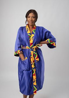 "Introducing our stunning Blue & African Kente Print Satin Kimono Robe, the epitome of comfort and elegance.  Crafted from a silky, soft satin material, it exudes an unmatched sense of opulence, making it the perfect addition to your loungewear collection. The first thing you'll notice is the vibrant and mesmerising African Kente print that adorns this robe. It features a captivating array of colours and patterns that pay homage to the rich traditions and heritage of Africa. The silky-smooth fabric caresses your skin, creating a sensation of pure indulgence. Its lightweight and breathable nature make it ideal for any season, ensuring you stay comfortable year-round. This robe isn't just for your personal enjoyment; it's also a thoughtful and timeless gift for a special person in your life. Fitted Satin Kimono, Kente Print, Satin Kimono, Geometric Graphic, Pajama Robe, Timeless Gifts, Womens Robes, Comfort Color, Satin Material