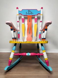 a child's rocking chair made out of crayons