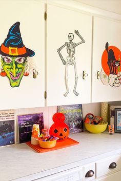 a kitchen counter topped with lots of halloween decorations