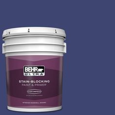 a purple paint bucket with the words behr ultra stain - blocking in white on it