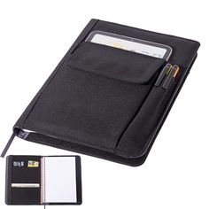 a black notebook with a pen and notepad attached to the cover, sitting next to a clipboard