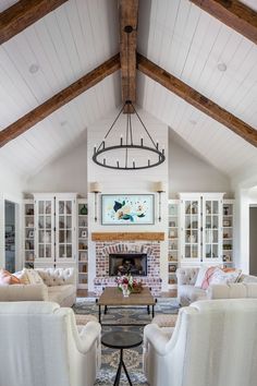 a living room filled with furniture and a fire place