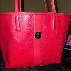 This Bag Is In Amazing Condition Like Brand New! The Color Is Beautiful And You Will Receive Many Compliments. This A Medium Size Shopper Bag And Can Be Used As A Personal Bag, Travel Bag And Also Business Because You Can Fit Books, Laptop And Any Necessities In This Beautiful Mcm Tote. Red Mcm Bag Outfit, Red Shopping Bag With Leather Trim, Modern Red Tote Box Bag, Hot Pink Mcm Bag, Pink Mcm Tote Bag, Mcm Bags, Shopper Bag, Medium Bags, Medium Size