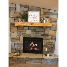 a stone fireplace with a sign above it