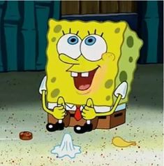 the spongebob character is sitting in front of a trash can