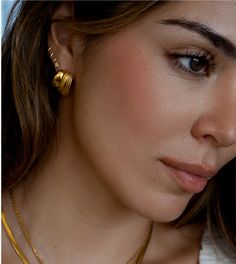 Our Maison Earrings boast a unique, retro inspired texture that is sure to make a statement. Crafted out of pure gold plated stainless steel, the earrings feature a minimalist design that is both lightweight and durable for long-term wear. Treat yourself or a loved one to a timeless piece of jewelry. 💦 Waterproof, Hypoallergenic, and Tarnish-Free. You can wear it to the beach, pool or even shower with it. 18k Gold Plated Stainless Steel Measurements: 24mm Quality: 100% Eco-Friendly; No Nickel, Trendy Gold Wrap Earrings For Everyday, Modern Gold Plated Drop Clip-on Earrings, Everyday Gold-tone Earrings, Modern Gold Plated Tarnish Resistant Clip-on Earrings, Gold Plated Ear Cuff For Everyday Wear, Modern Gold Plated Earrings For Everyday Wear, Modern Ear Cuff With Matching Earrings For Everyday, Modern Gold Plated Wrap Earrings, Gold Ear Cuff With Matching Earrings For Everyday