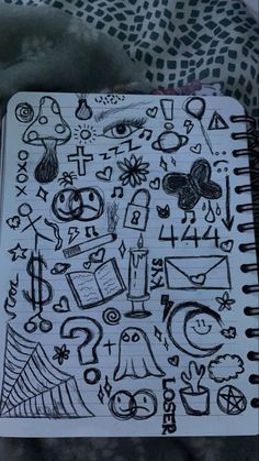 an open notebook with doodles on it