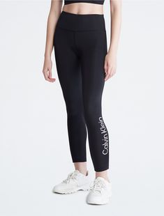 Optimized for sports and engineered for performance, these pull-on leggings feature 4-way stretch for total flexibility. Crafted from an extra soft stretch blend with moisture wicking and a quick-dry design. Finished with a high rise waistband and Calvin Klein logo styling.  Material: 77% Polyester, 23% Spandex. Ck Logo, Trouser Outfits, Logo Material, Calvin Klein Woman, Athletic Outfits, Black Leggings, Women's Leggings, Quick Dry, Moisture Wicking