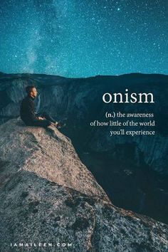 a man sitting on top of a mountain under a night sky with the words, omism