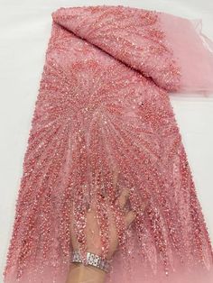 This high quality Fabric is measured in 5 Yards With Embroidered Beading and Sequin. It is soft, very delicate and beautiful. This high Quality Fabric is made with Fashion embroidered rhinestones can be used in making party wedding dresses, skirts, shawls, scarves and other other fashion apparels as you would like. Size : Length : 5 yards (180 inch). Width: 50 inch (Please allow slight deviation for the measurement data ,±1 inch) Material: 100% Polyester, Tulle Lace Fabric, Eco-Friendly embroide Pink Beaded Embroidered Fabric For Party, Pink Sequin Fabric With Pearl Embroidery For Party, Pink Sequin Fabric With Rhinestones For Party, Pink Beaded Lace Embroidered Fabric, Pink Lace Fabric With Rhinestones Embroidery, Pink Rhinestone-embroidered Lace Fabric, Elegant Pink Embellished Sequin Fabric, Pink Pearl Embroidered Lace Sequin Fabric, Pink Sequin Lace Fabric With Pearl Embroidery