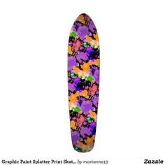 a skateboard with colorful paint splattered on it's bottom and sides