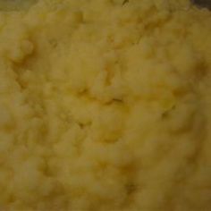 mashed potatoes are being cooked in a pot