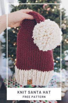 a knit santa hat with a pom - pom on top and text overlay that reads, knit santa hat free pattern