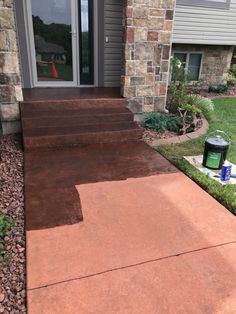 concrete steps leading to the front door of a house