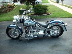 a blue motorcycle parked in a parking lot