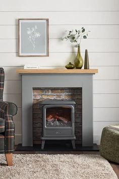 a living room with a fireplace and chair