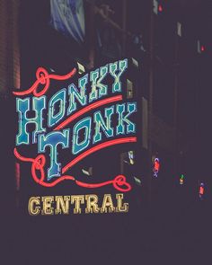 a neon sign that says honey honks to central