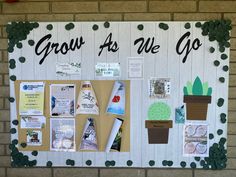 a bulletin board with plants and pictures on it that says grow as we go,