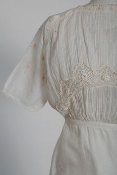 "Stunning rare Antique vintage early 1910 Edwardian cotton lawn dress White natural cotton with hand embroidered pink floral motif Irish floral crochet bodice with wrap layered skirt eye hook closure Great vintage condition for age, few fant age spots (see photos) overall excellent wearable condition M e a s u r e m e n t s: Size: fits like a XS Bust: 17\" Waist: 12 3/4\" Hips: 20 1/2\" Total Length: 50\" Sleeves: 14\" (from neck) Label: unbranded Fabric: cotton +All Measurements are taking whil Victorian Cotton Summer Dress, Victorian Style Cotton Summer Dress, Victorian Cotton Dress For Summer, Summer Victorian Dress For Garden Party, Vintage Cotton Lace Dress With Ruffles, Cotton Victorian Dress In Cottagecore Style For Spring, Cotton Cottagecore Victorian Dress For Spring, Cottagecore Cotton Victorian Dress For Spring, Cottagecore Victorian Cotton Dress For Spring