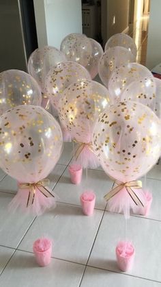 pink and gold confetti filled balloons on the floor