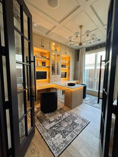 an open door leading to a kitchen and living room