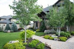 a house with landscaping in the front yard