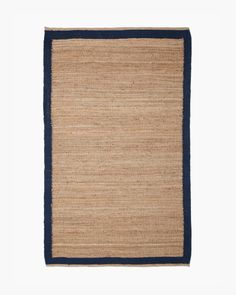 an area rug with blue border on the bottom and tan, black trim around the edges