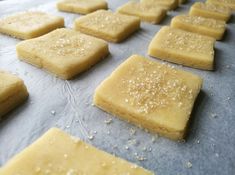 there are many pieces of food on the baking sheet