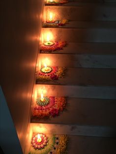 candles are lit on the steps to decorate with flowers and garlands for diwaling