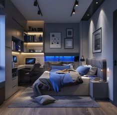 a bedroom with a bed, desk and computer on the wall in front of it