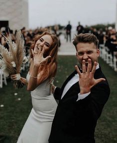 a man and woman standing next to each other in front of an outdoor wedding ceremony