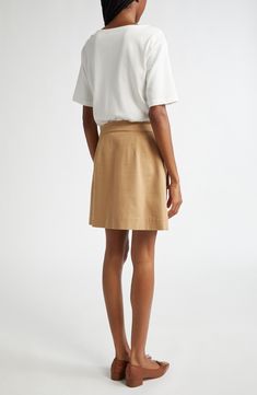 Take the guesswork out of getting dressed with this mixed-media mini fashioned with a soft white T-shirt over a structured A-line cargo skirt. Fronted with capacious bellows pockets, this one-and-done piece will take you anywhere. 34" length Hidden side-zip closure Boat neck Short sleeves Front flap-bellows pockets 100% cotton Dry clean Imported A-line Skort For Workwear In Fall, Casual Linen Mini Skirt, Beige Mini Skirt For Spring Workwear, Beige Skort For Workwear In Spring, Beige Skort For Spring Workwear, Beige Cotton Mini Skirt For Work, Beige Skort For Workwear In Fall, A-line Mini Skirt For Work, Cotton A-line Mini Skirt