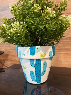 a potted plant sitting on top of a table