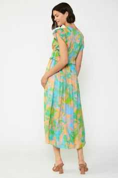 This dress is so striking—first of all, that abstract floral print is an absolute showstopper with its rainbow effect. But it doesn't stop there. Cut from lightweight jacquard featuring a subtle jacquard texture, the dress has tons of tiny pleats at the bodice, dainty ties, and fluttery pleated sleeves, all before flowing to a shin-skimming length. •V-neckline •Pleated bodice •Short sleeves •Tie detailing at front •Elasticized waist •Original 'Floral Abstraction' print, designed by Current Air D Green Abstract Print Spring Dress, Green Spring Maxi Dress With Vibrant Print, Vibrant Multicolor Print Midi Dress For Spring, Spring Green Maxi Dress With Vibrant Print, Vibrant Green Floral Print Maxi Dress, Green Abstract Print Maxi Dress For Spring, Spring Green Maxi Dress With Abstract Print, Green Maxi Dress With Abstract Print For Spring, Vibrant Green Maxi Dress For Spring