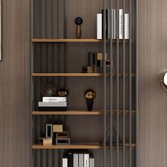 a bookshelf with many books on it in a room next to a clock