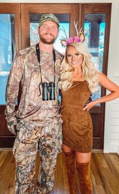 a man and woman dressed up as deer hunters for an outdoor halloween costume party, standing in front of a wooden door