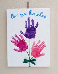 a handprinted card with the words love you bunches and two flowers on it