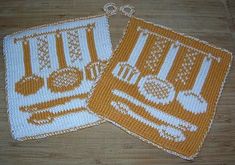 two orange and white crocheted potholders on a wooden table with spoons