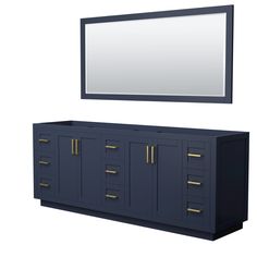 a large mirror above a blue cabinet with drawers